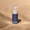 LYKKEGAARD Facial Sun Cream SPF 30 on sandy surface, offering organic, invisible sun protection for radiant skin.