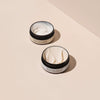 NATULIQUE Organic Medium Hold Hair Wax jars with creamy textures on a beige background, sustainable professional quality.