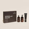 NATULIQUE Organic Nourishing Gift Set for moisturizing frizzy hair with hydrating shampoo, conditioner, and styling cream.