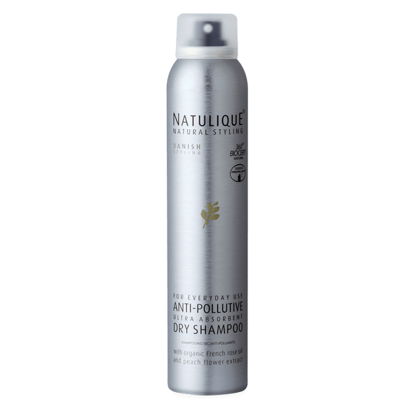 NATULIQUE Organic Anti-Pollutive Dry Shampoo in a sleek silver canister for detoxifying and refreshing hair.