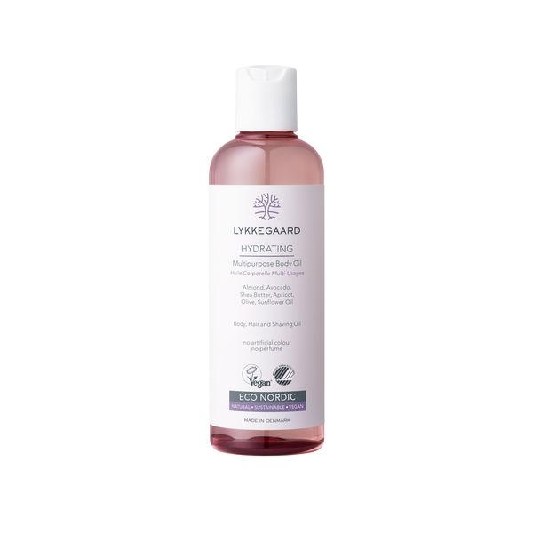 LYKKEGAARD Hydrating Multipurpose Body Oil in a pink bottle for silky skin and deep hydration. Vegan and eco-friendly.