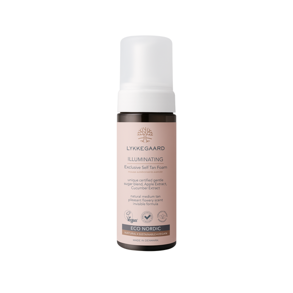 LYKKEGAARD Illuminating Exclusive Self Tan Foam for a natural, radiant glow without UV damage.