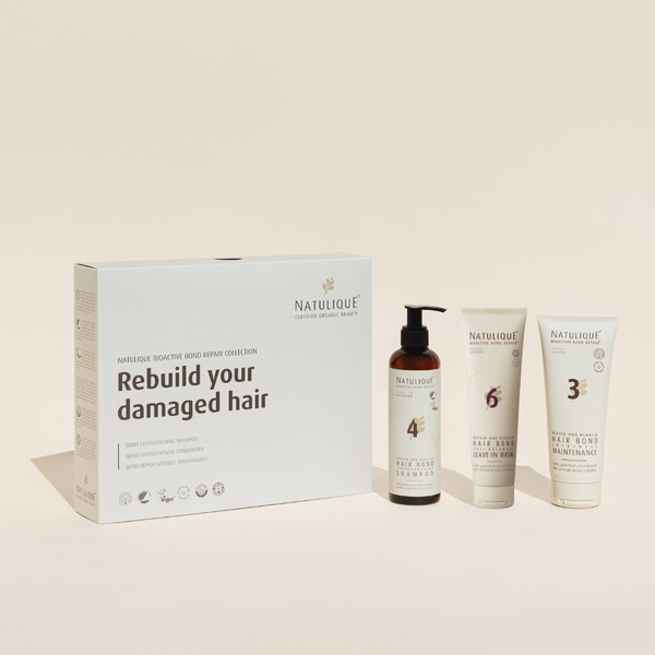 NATULIQUE Organic Bond Repair Gift Set for damaged hair, featuring shampoo and treatments for strength and shine.