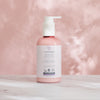 LYKKEGAARD Nourishing Softening Hand Cream bottle on pink background, featuring organic ingredients for deep hydration.