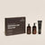 NATULIQUE Organic Nourishing Gift Set for moisturizing frizzy hair with hydrating shampoo, conditioner, and styling cream.
