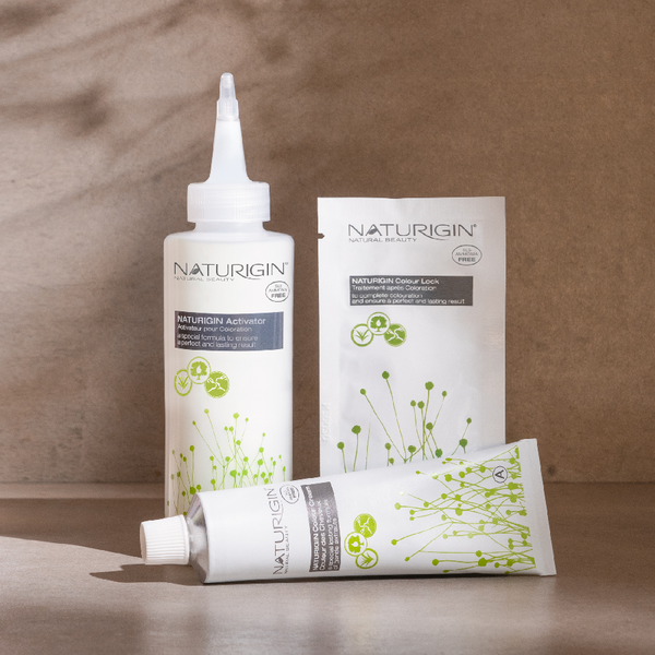 NATURIGIN hair color products including Activator, Colour Lock, and cream for natural, ammonia-free hair coloring.