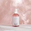 LYKKEGAARD Antibacterial Hand Sanitizer in a pink bottle on a marble surface, featuring organic ingredients for luxury hygiene.