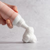 NATURIGIN Dry Shampoo Mousse being dispensed, showcasing creamy foam for effortless hair refresh and volume.
