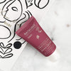 NATULIQUE Organic Protective Hand Cream tube on a stylish background for luxurious hydration and natural skin care.