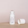 LYKKEGAARD Delicate Orange Anti-perspirant Deo Roll-On on a wooden surface with cap removed.